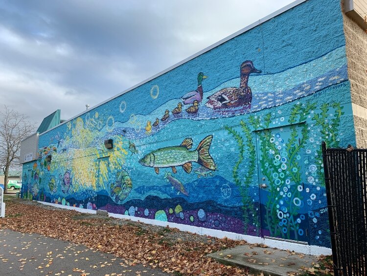 This Joel Schoon-Tanis mural is on the Cruise and Travel Experts Building, which fronts on Savidge/M104, in downtown Spring Lake. (Bruce Buursma)