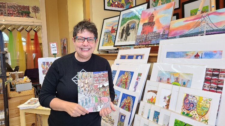 Artist Carolyn Stich in her downtown Holland shop.