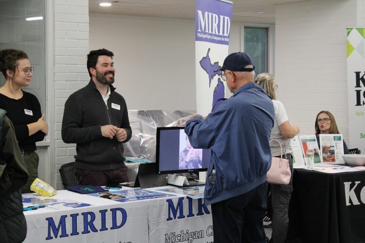 Local organizations had display tables with information and resources for attendees. (D&HHS)