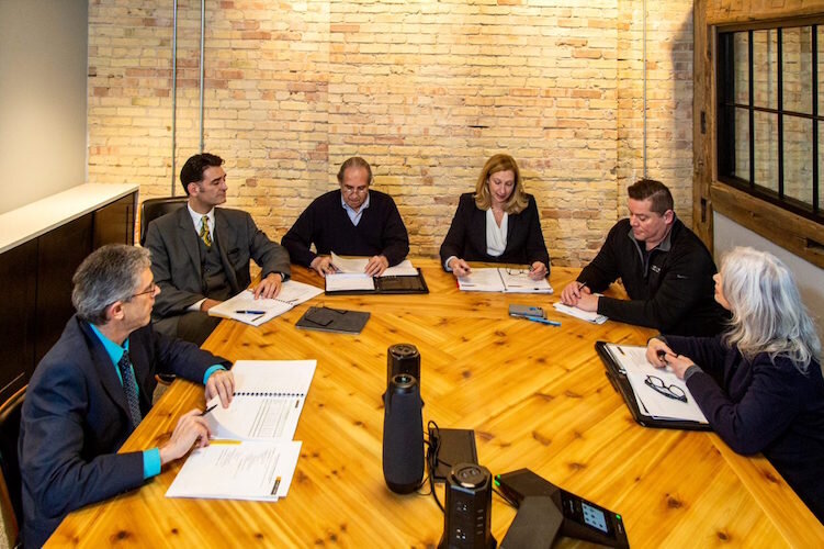 Deidra Mitchell, center, and Jamie Stuck, NHBP Tribal Council Chaperson, to her right, at a board meeting of the Waséyabek Development Company at their headquarters.