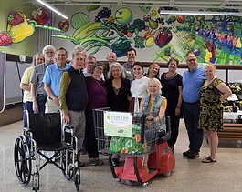 A Holland Rotary Club partners with Gentex to donate accessible equipment to Food Club & Opportunity Hub. (CAH)