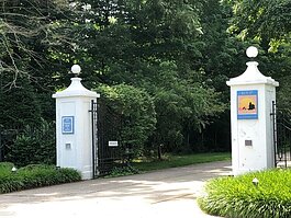 White pillars mark the entrance to the former Lakewood Farm, aka Getz Zoo, as they appear today. (Kym Reinstadler)