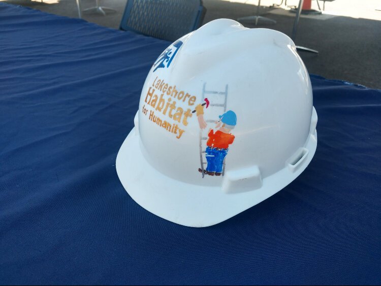 A hardhat is on display at the Park Vista Place build by Lakeshore Habitat for Humanity and Jubilee Ministries.