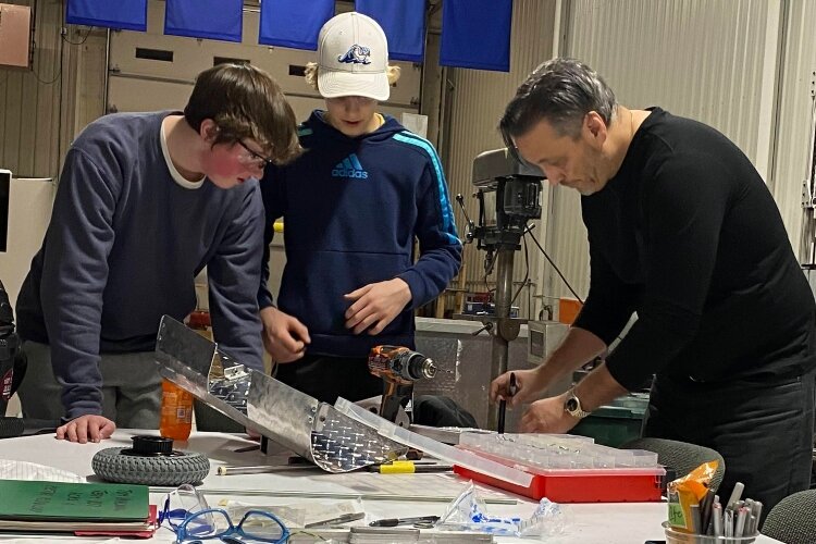 Mentors from area tech industries are critical to robotics teams' success.