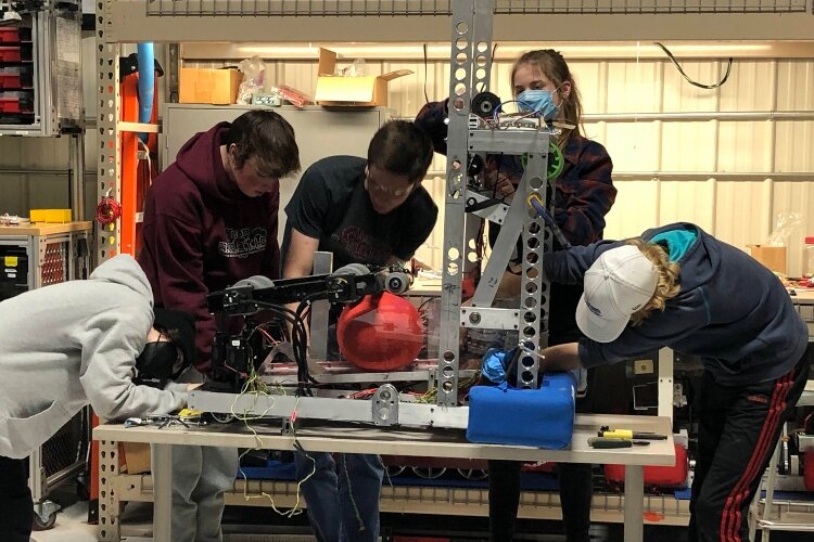 Robotics students design, build, and program their robots before competing against other schools.