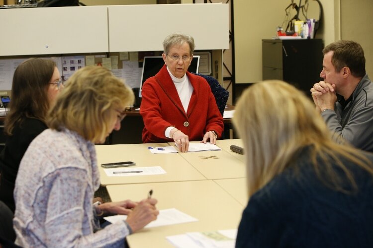 Kay Walvoord leads an HSO staff meeting. (J.R. Valderas)