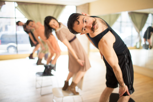 Members of DITA practice for a coming performance.