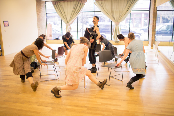 Members of DITA practice for a coming performance.