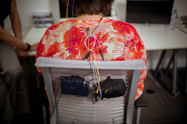 Lead Technician Emily Quinn connects Deborah Johnson Wood to the computer for biofeedback