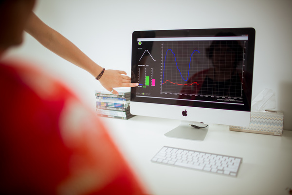 Lead Technician Emily Quinn connects Deborah Johnson Wood to the computer for biofeedback