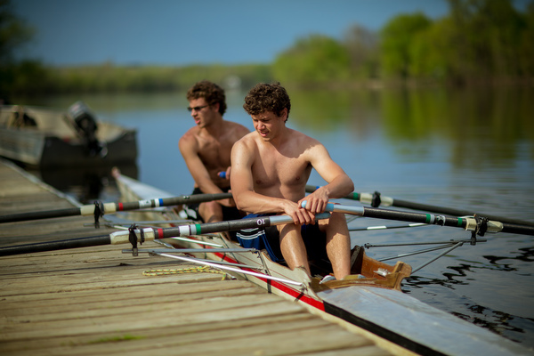 Students get into a shell on the Grand River to practice rowing.