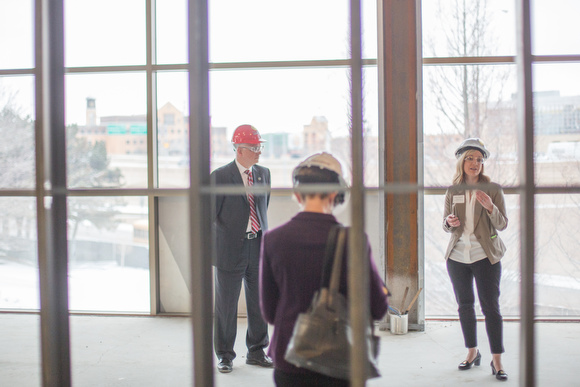 Visitors tour the new site under construction.