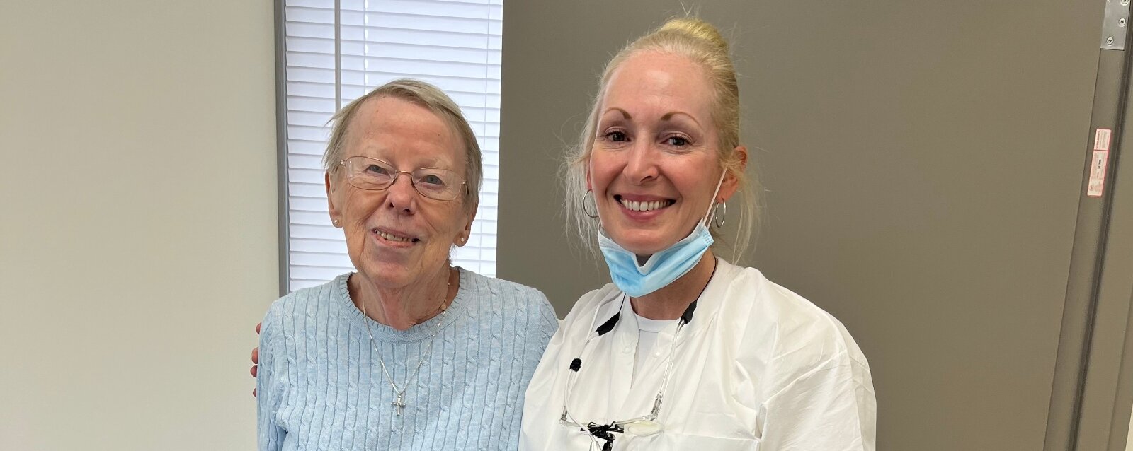 Judy Logan with her dentist, Dr. Cain, at her office. Dr. Cain discovered Logan’s oral cancer after Logan pointed out a persistent sore spot on her tongue.