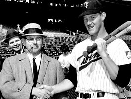 Zeeland native Jim Kaat, right, poses with his father in 1965. Kaat will be inducted into the Baseball Hall of Fame this year.