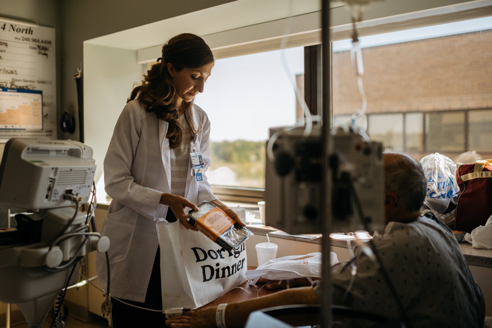 Sarah Berry explains the medically tailored meal program to a patient who is being released from Beaumont Hospital, Troy.