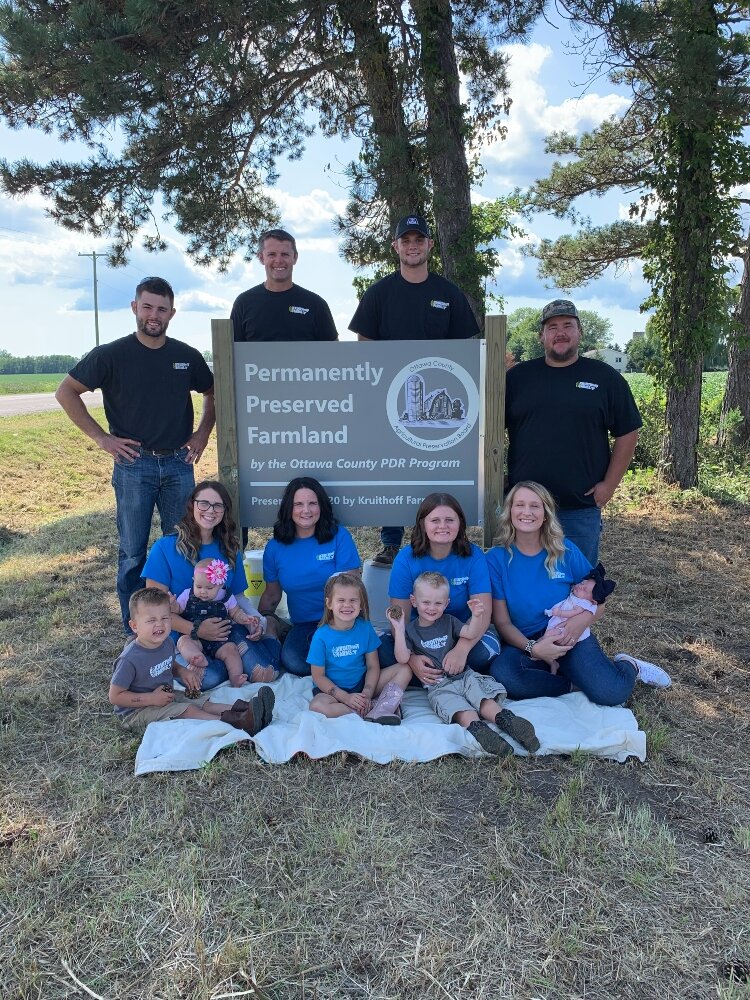 Three generations of the Kruithoff family relish the moment they officially protected 148 acres of their farmland. (Ottawa County photo]