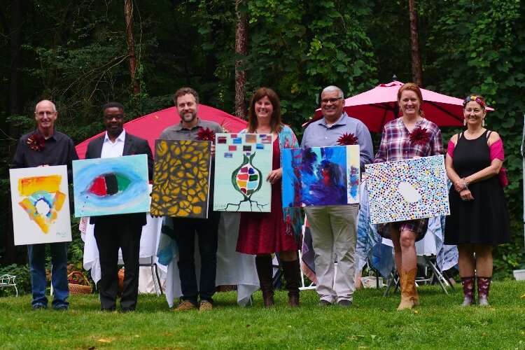 The 2021 Leadership on Canvas artists: Mark Herman, Mark Washington, Christopher Andrus, Emily Loeks, Nelson Sanchez, and Maggie Lancaster with Cynthia Hagedorn on the right. 
