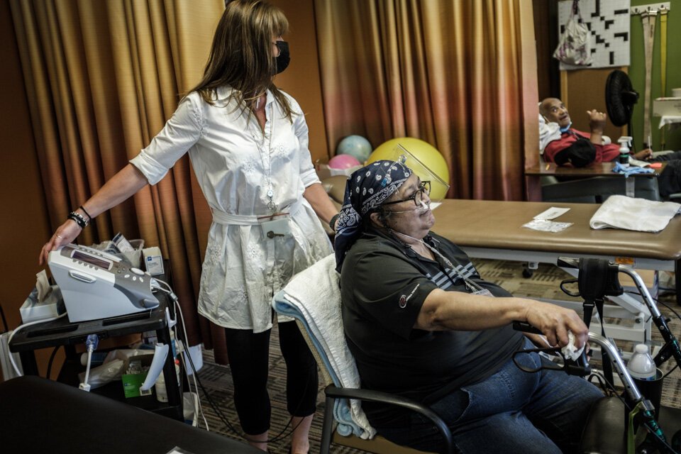 Christy Junglas, a physical therapist, works with a participant at the LifeCircles PACE day center. LifeCircles provides primary care and physical, speech, and occupational therapies to all participants.