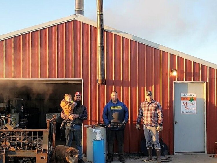 Sugar Bin owners built a larger building for on the farm to accommodate increased production. From left, Dave Ten Brink, Mark Raterink, and Ted Costigan.