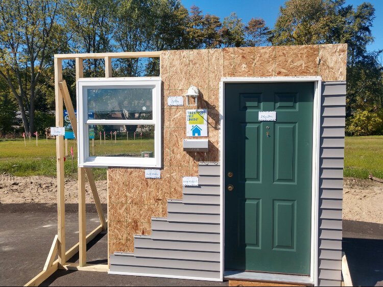A model front door is on display at the Park Vista Place groundbreaking ceremony.