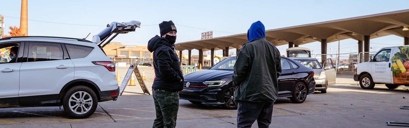 Drivers line up to pick up food boxes they ordered online at Eastern Market.