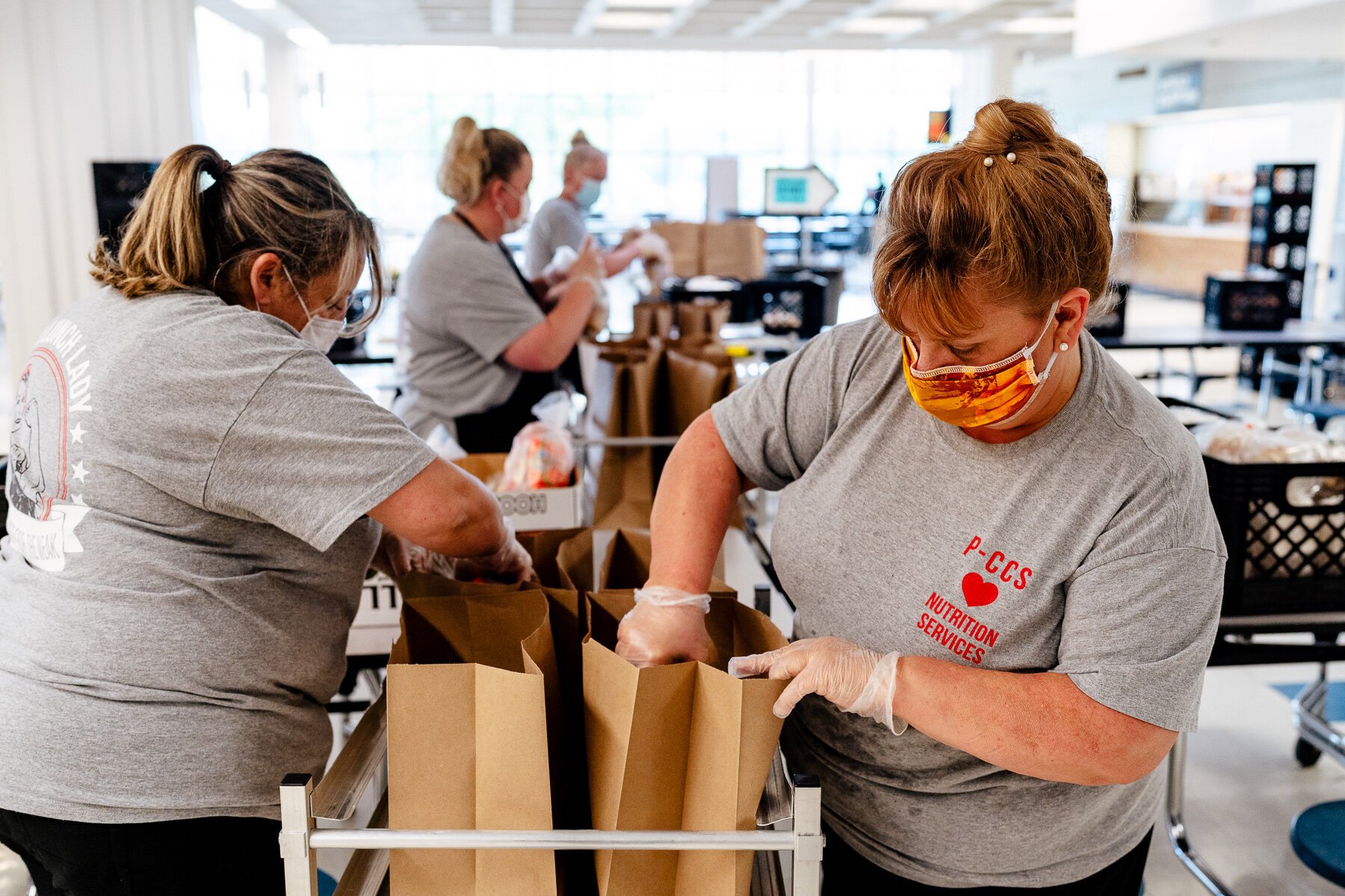 Plymouth-Canton Community Schools staffers prepare meals for pickup.