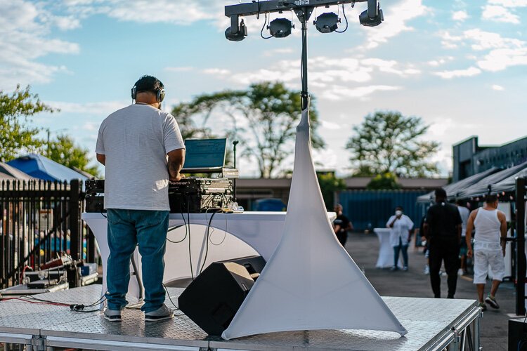 A DJ plays salsa music at Fantazma Market.