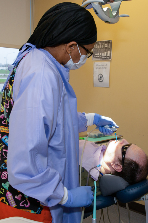 Clinicians work on a patient at Cherry Health.