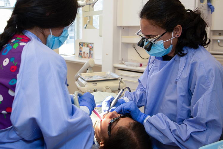 Clinicians work on a patient at Cherry Health.