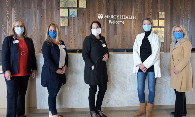 Herman Miller employees deliver donated masks and other PPE to Mercy Health.