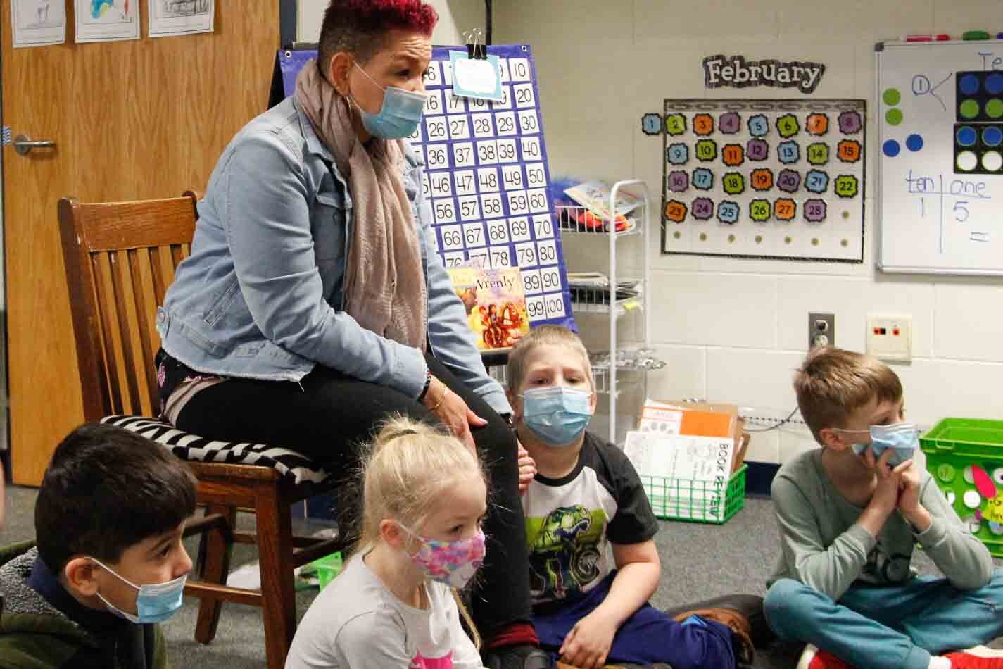 Behavior Specialist Marcy Carter asks students at Kalamazoo's Northwood Elementary to discuss their feelings.