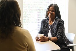 Datasha Chapman, a member of Calvin University's Lay Ambassadors for Mental Health program, chats with a colleague.