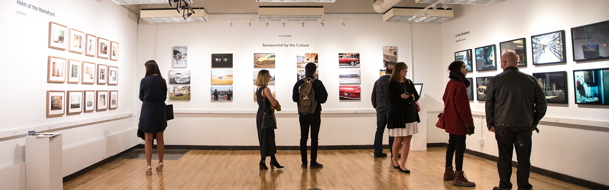Viewers exploring the Annual Student Exhibition at Kendall College of Art and Design