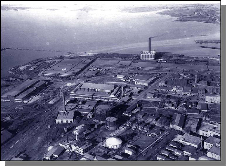 Industrial shoreline of Muskegon Lake seen from above.