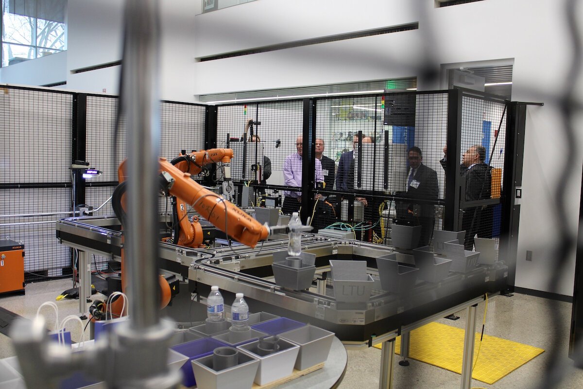 While visitors look on, robots in the new Rockwell Automation/McNaughton-McKay Electric Co. I4.0 Robotics and Industrial Automation Laboratory are hard at work.
