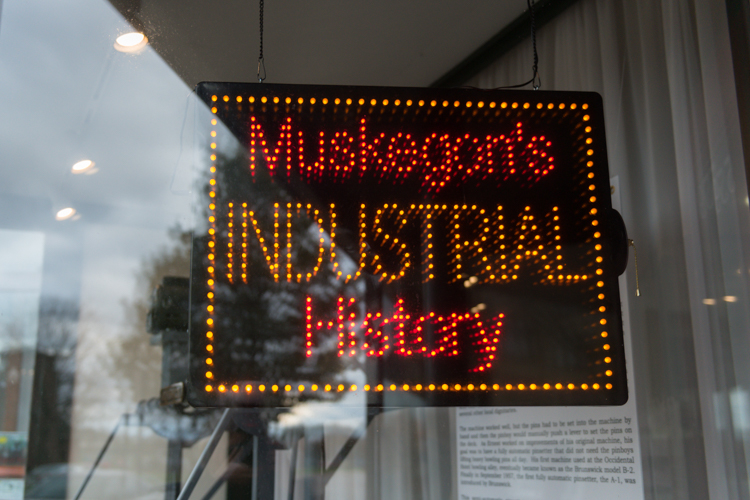 This neon sign hangs in the museum's window.